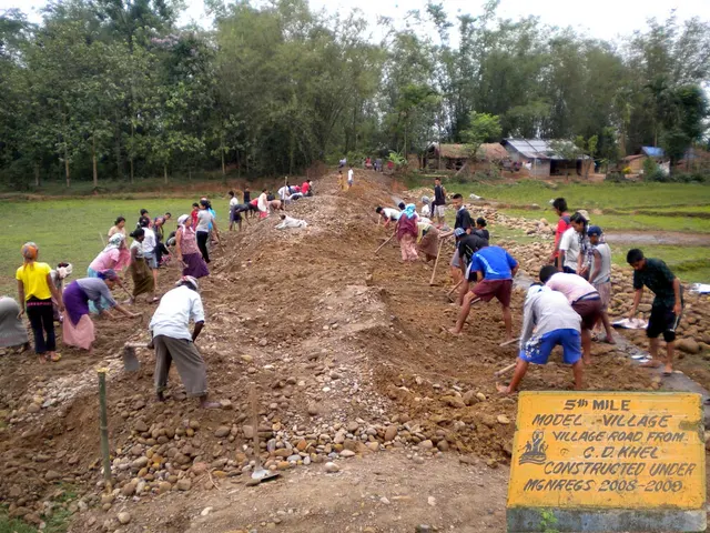 A village road under construction through hilly terrain