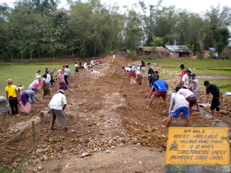 A village road under construction through hilly terrain